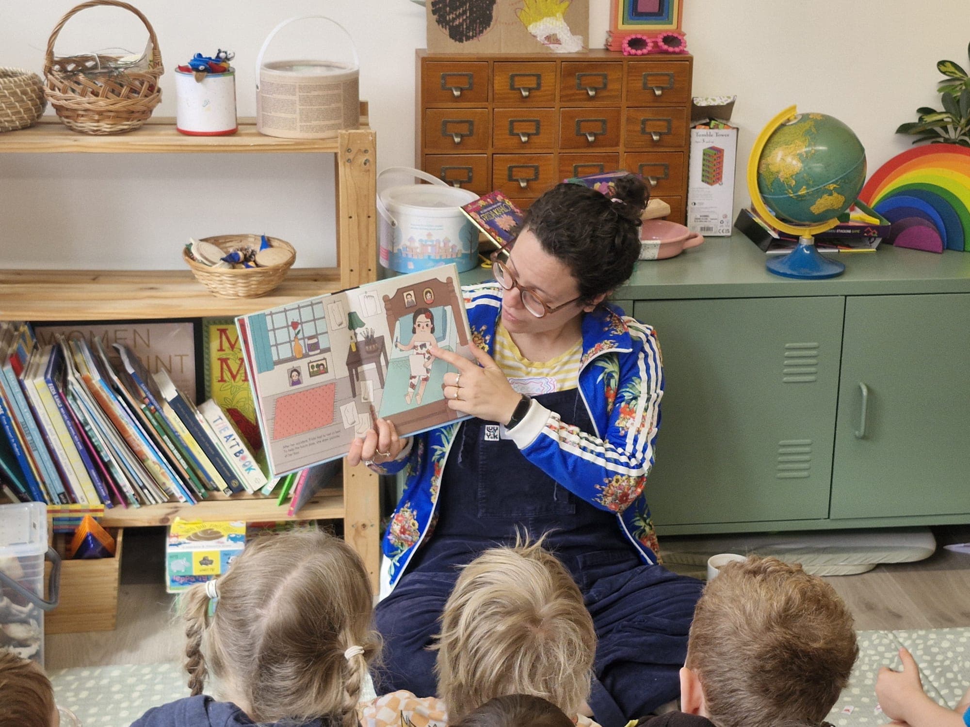 Becca reading to children at Noisy Book Club